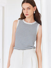 a woman in striped tank top